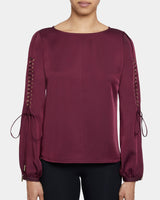 LIVI Long Sleeve Top with Grommet Detail in Fluid Crepe.