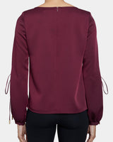 LIVI Long Sleeve Top with Grommet Detail in Fluid Crepe.