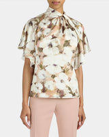 JOYCE Mock Neck Blouse with Short Cape Sleeves in Floral Georgette